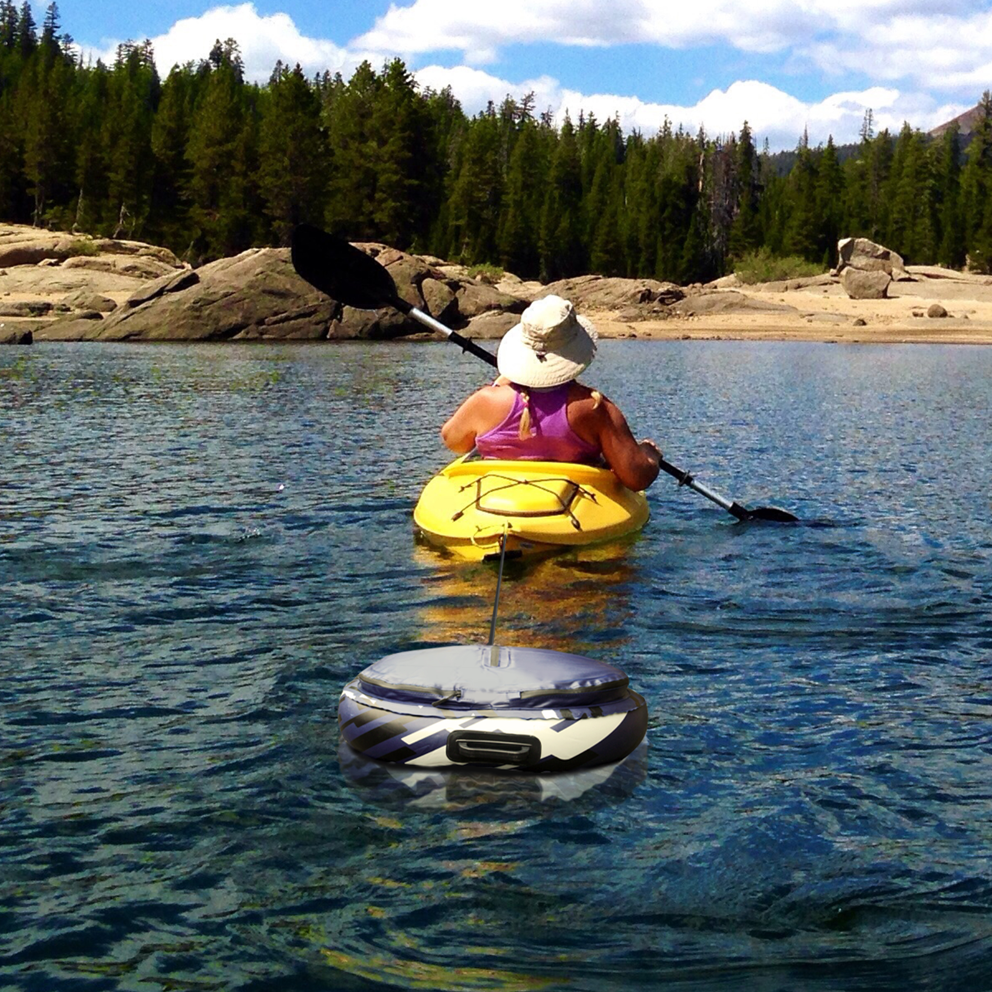 Rangland Cooler being towed by kayak